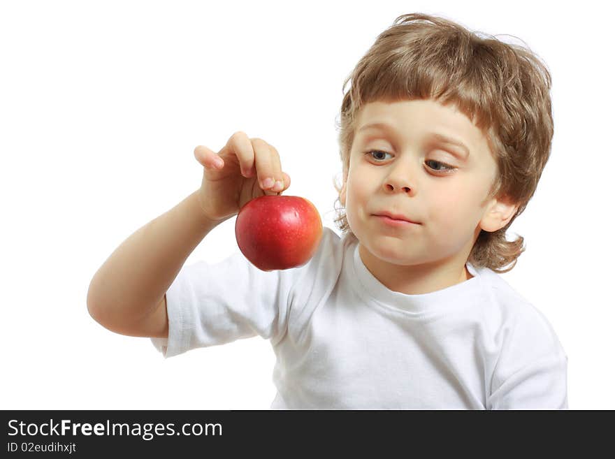 Little beautiful child playing and eating an apple - isolated on white. Little beautiful child playing and eating an apple - isolated on white