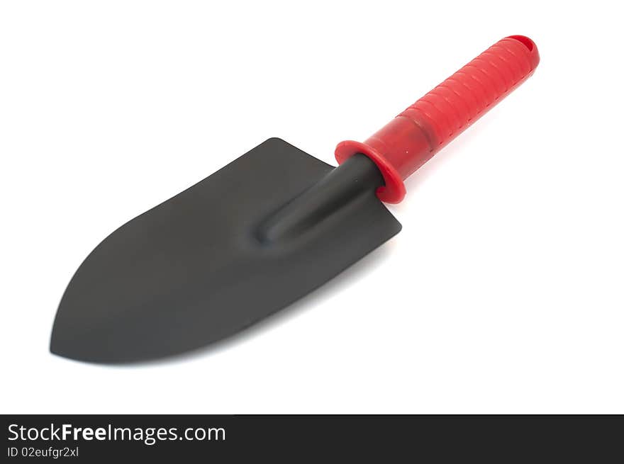 A mini garden shovel isolated on a white background