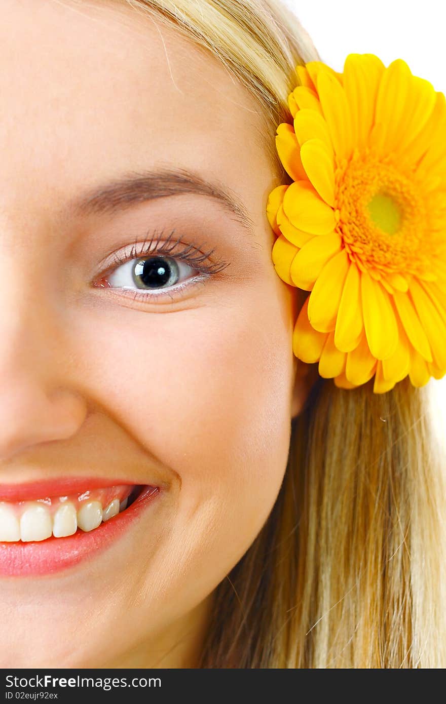 Happy blond woman with flower