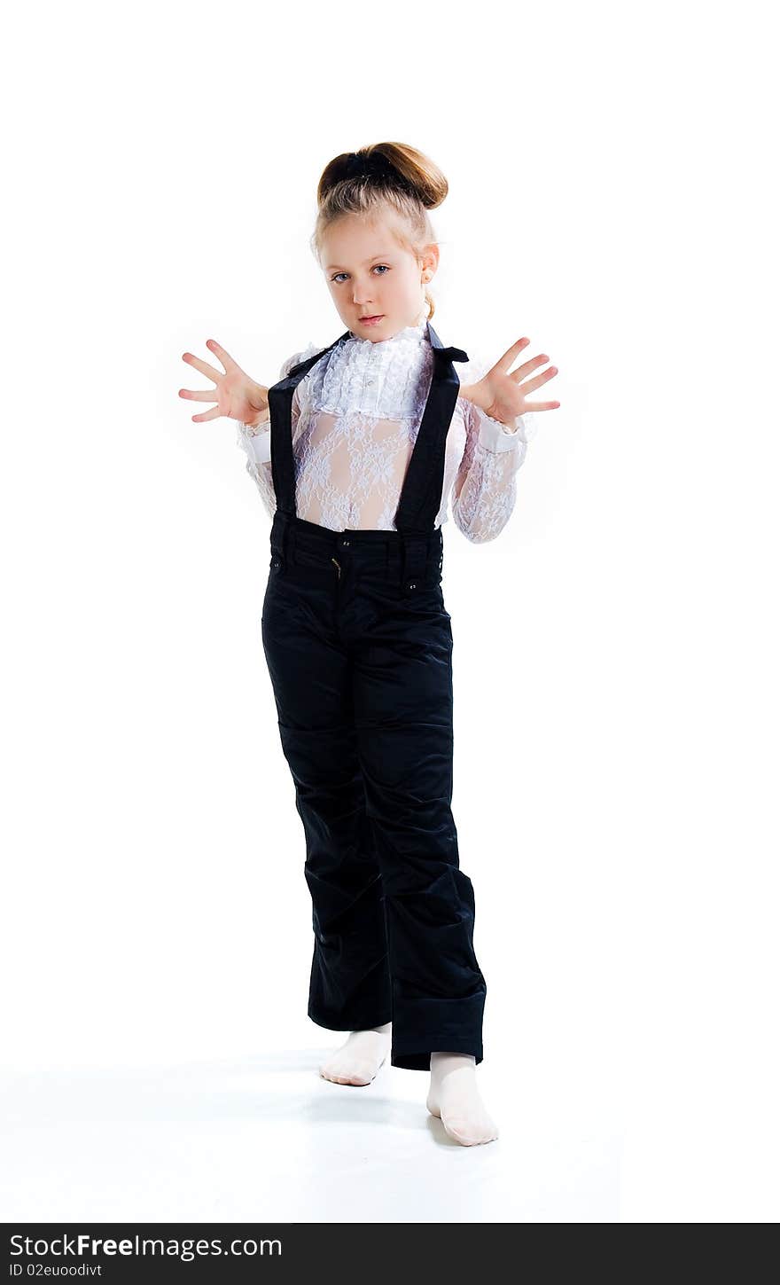 Beautiful little girl in black overall. Isolated on a white background overall