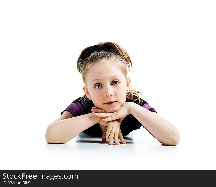 Beautiful little girl lie. Isolated on a white background. Beautiful little girl lie. Isolated on a white background