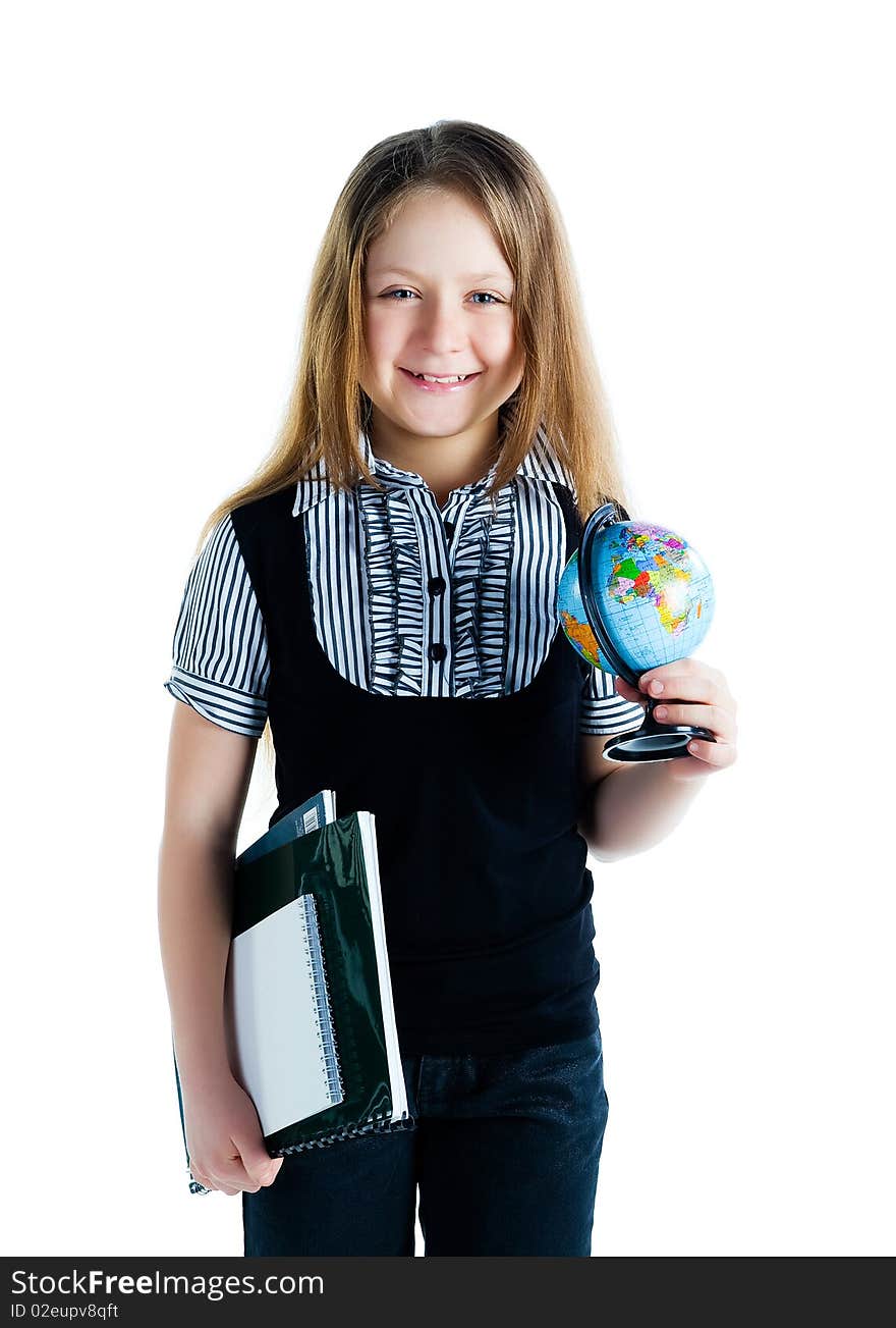 Cute schoolchild with terrestrial globe and notebooks on white