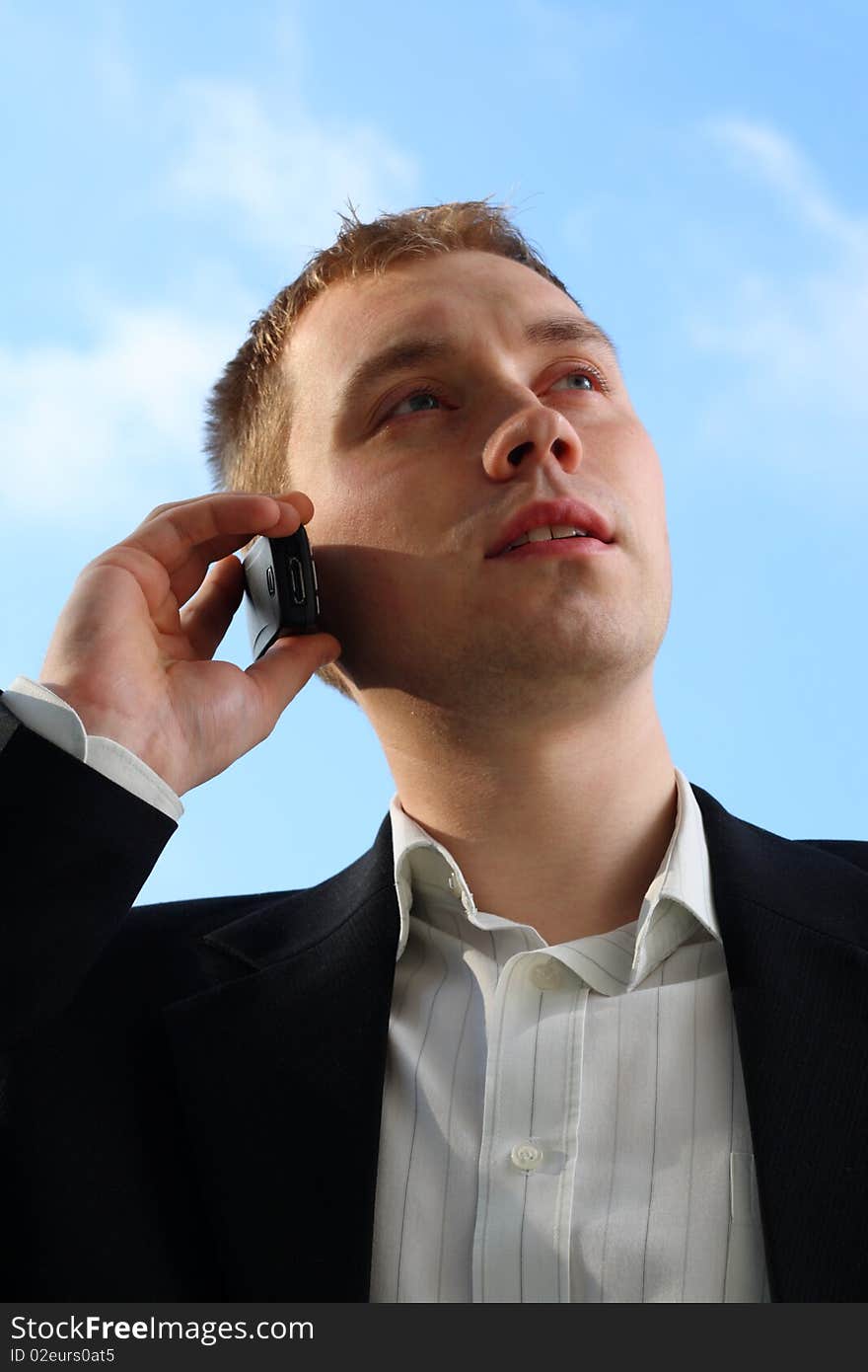 Young man talking on the mobile phone