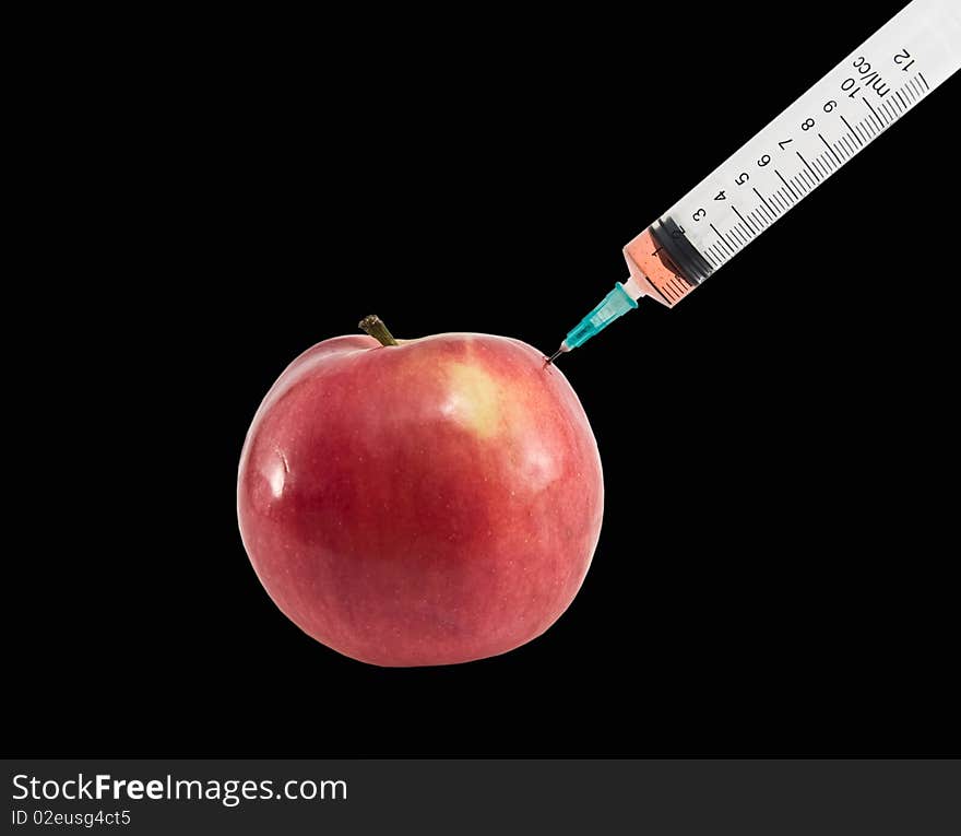 Apple and syringe.