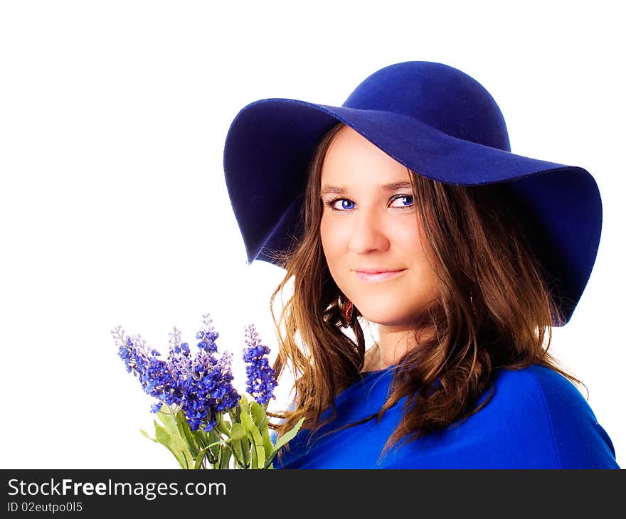 Beautiful woman in hat holding lavender flower over white background