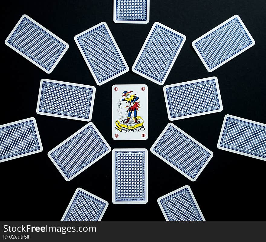 Playing cards on the black background