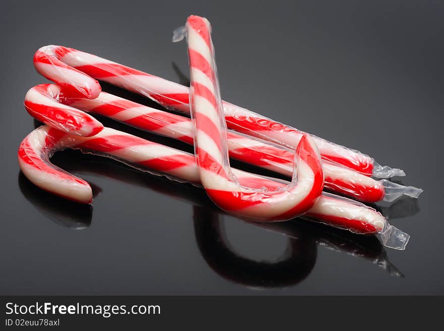 Striped christmas candy on a black background