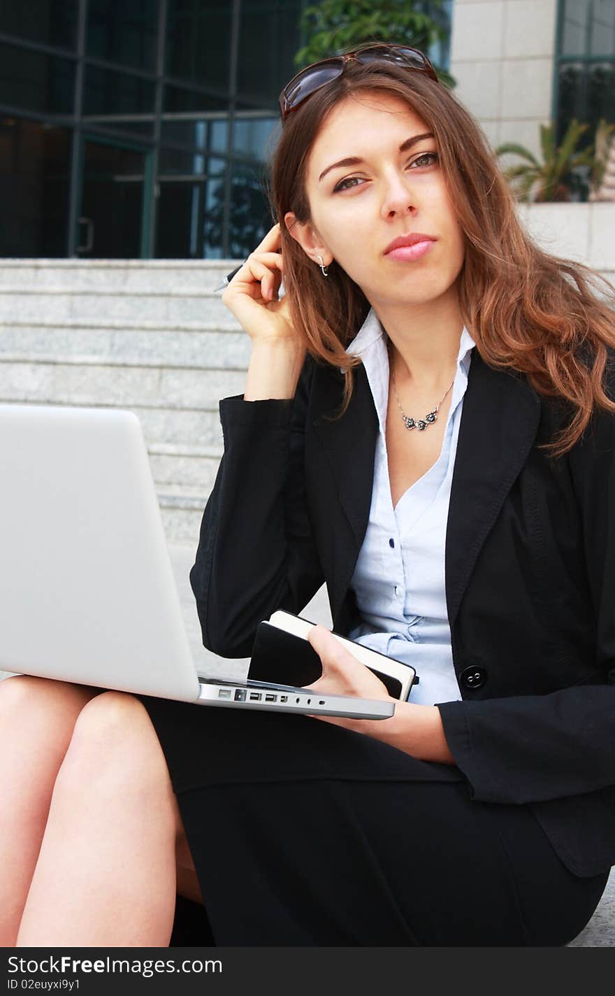 Business woman sitting on stairs with laptop. Business woman sitting on stairs with laptop