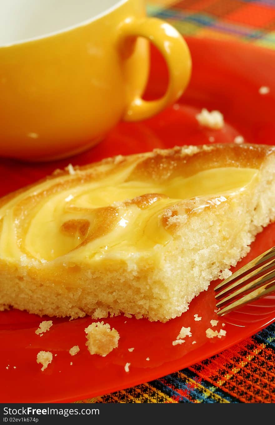 cake and cup on red plate