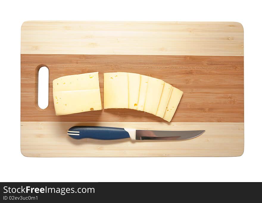 Chef's knife hopping an cheese on an wooden cutting board - white background.