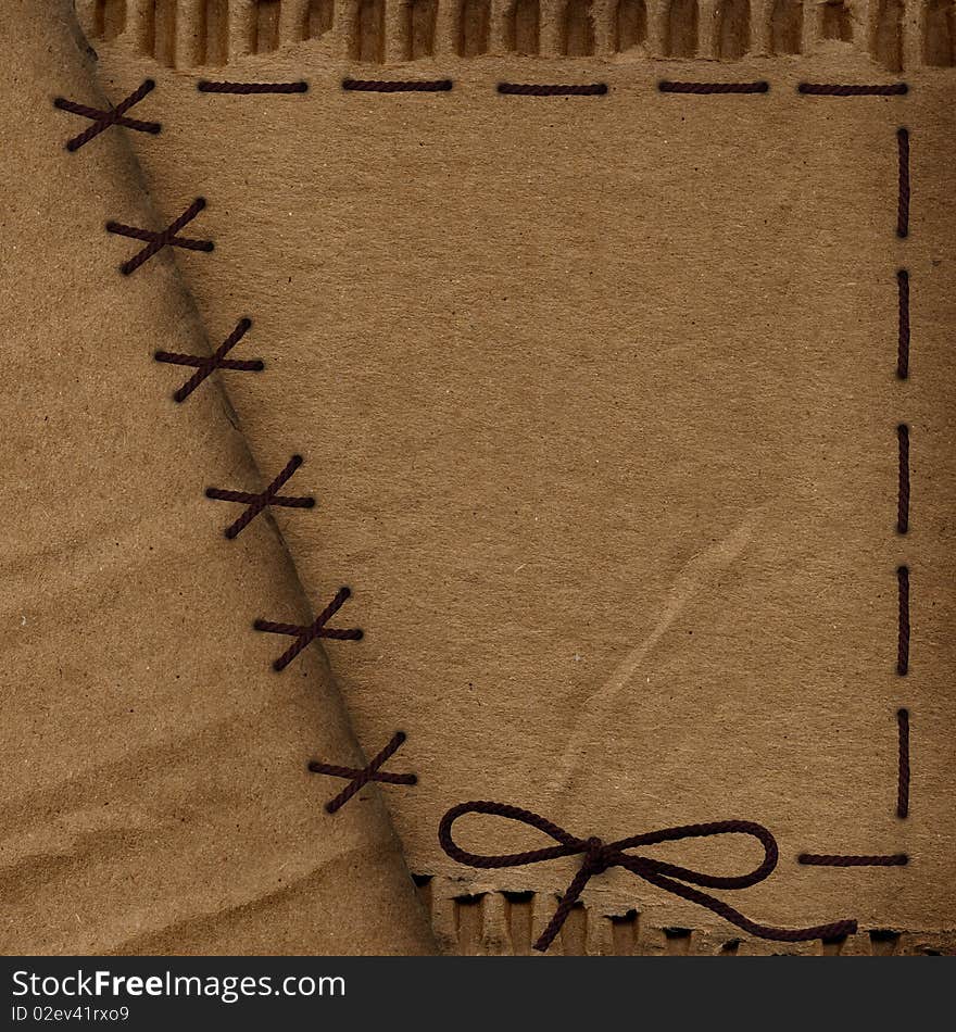 Old cardboard background with rope. Old cardboard background with rope