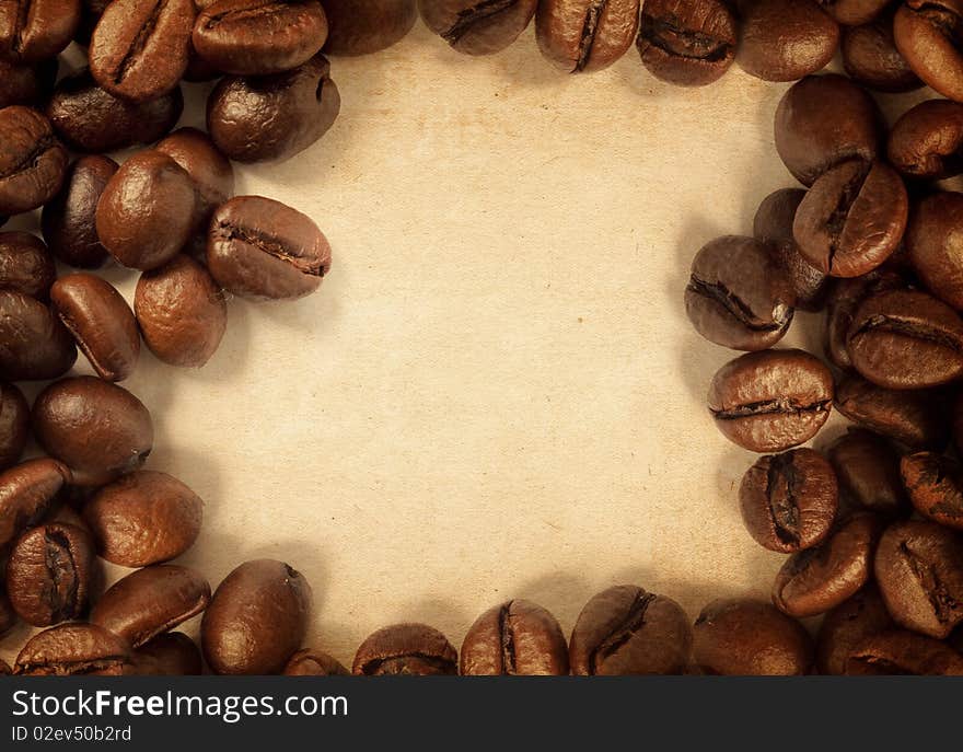 Coffee beans on a vintage texture. Coffee beans on a vintage texture