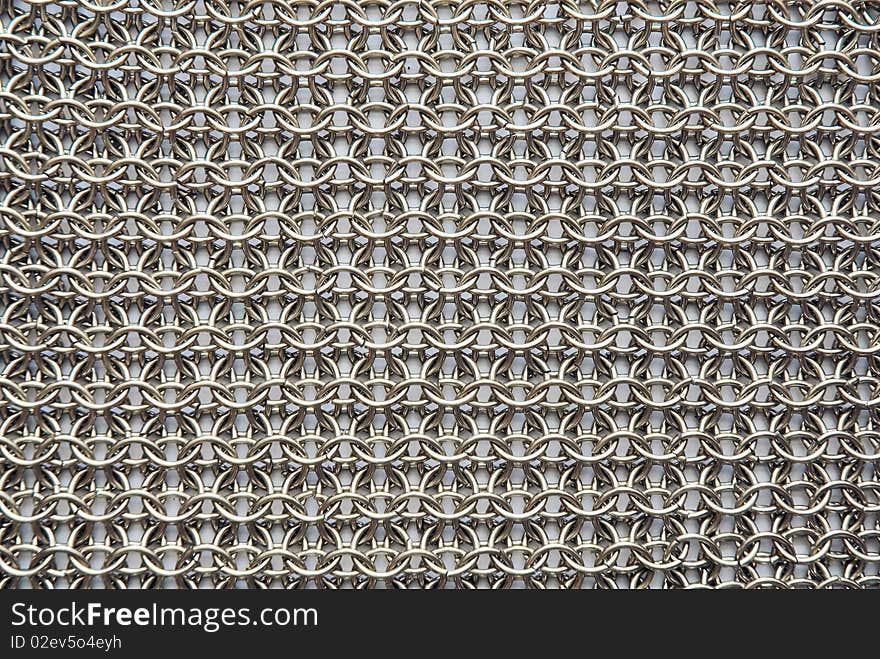 Chain armour on a white background. Abstract texture. Chain armour on a white background. Abstract texture.