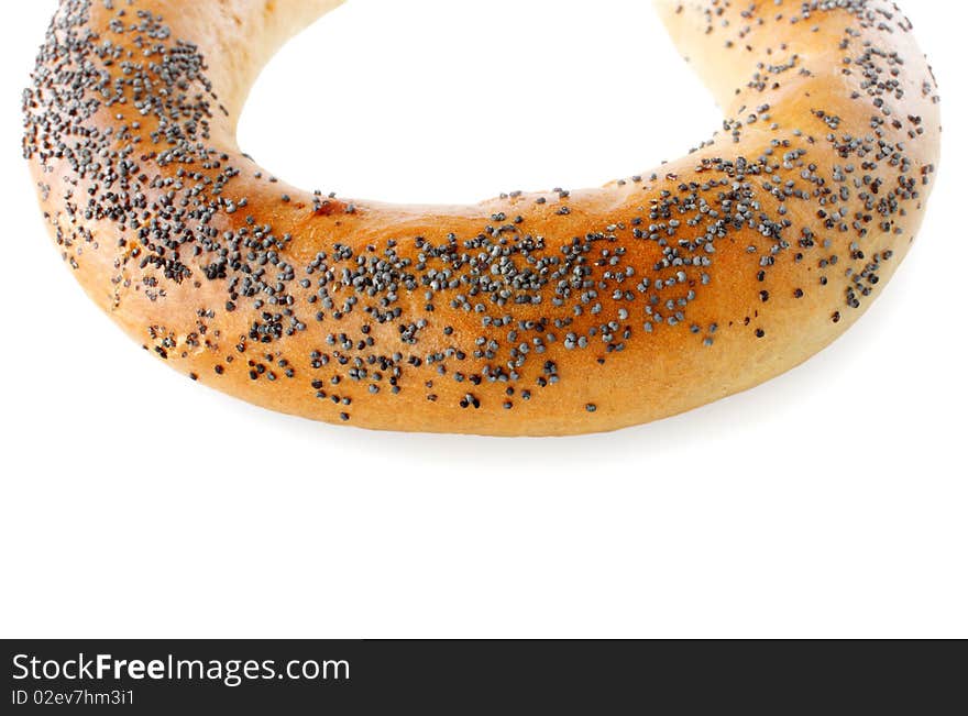 Bagel with  poppy seeds isolated on white