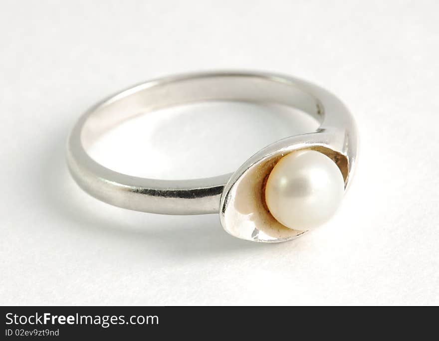 Closeup view of silver ring with pearl