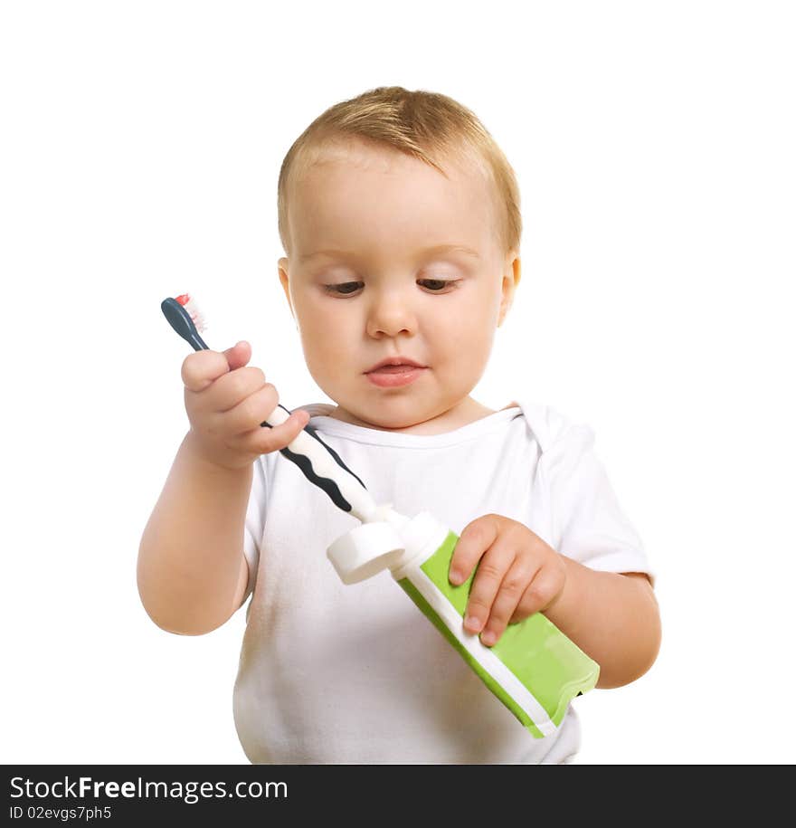 Serious kiddy with a tooth brush and toothpaste