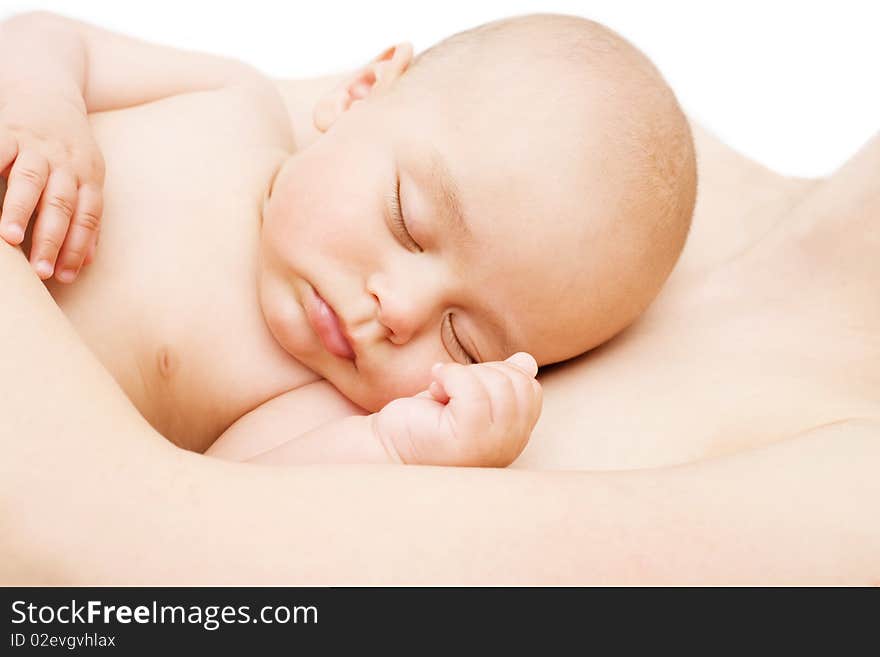 Sleeping baby on breast of his mother