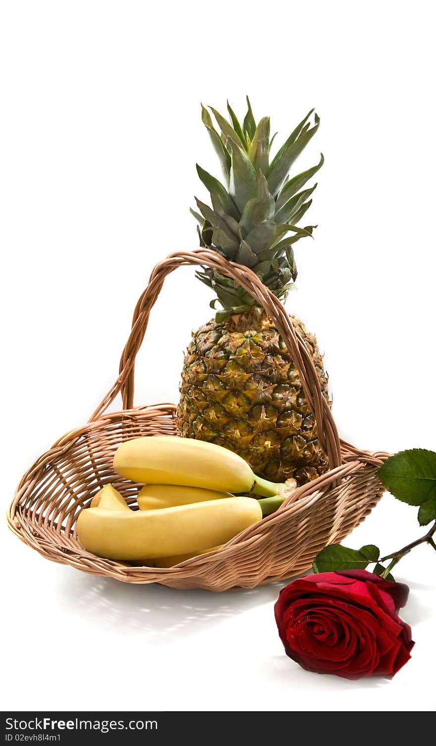 Still-life with basket with fruits on the white background