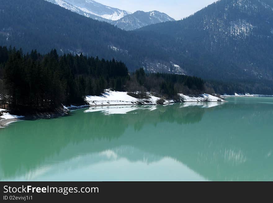 A lake in the mountains at winter. A lake in the mountains at winter.