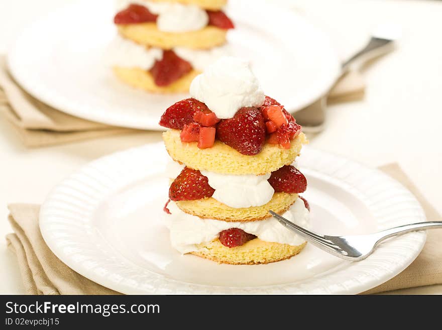 Three layer strawberry shortcake with fresh whipped cream. Three layer strawberry shortcake with fresh whipped cream