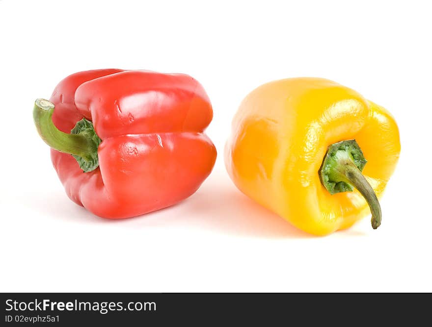 This red and yellow peppers on a white background