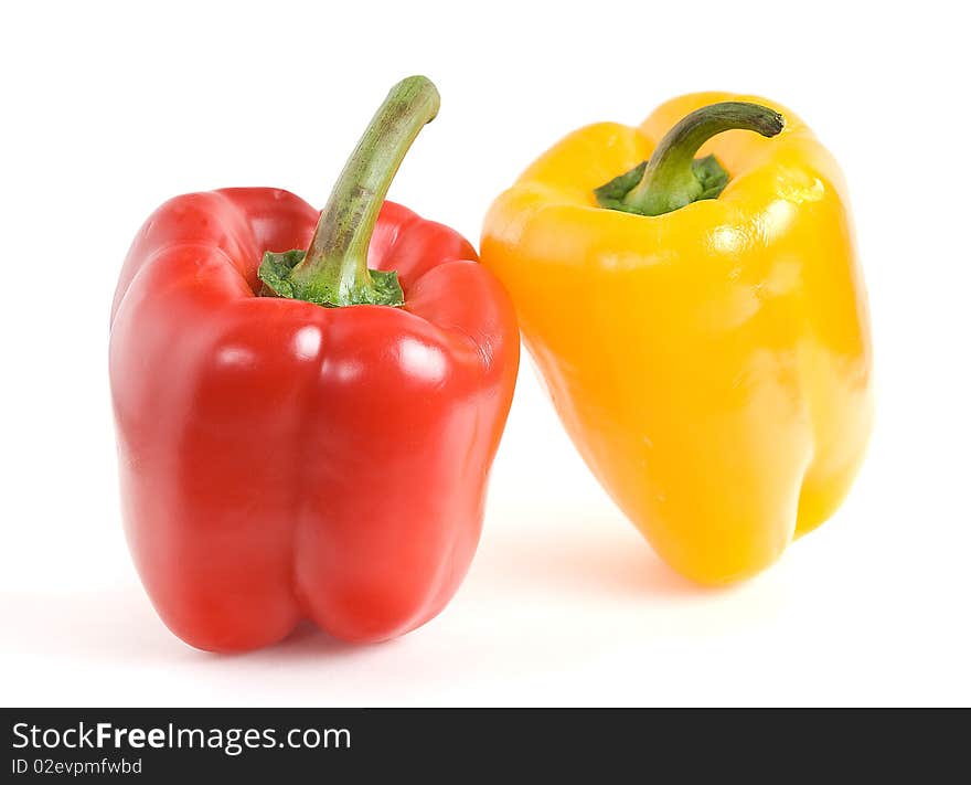 This yellow and red peppers on a white background