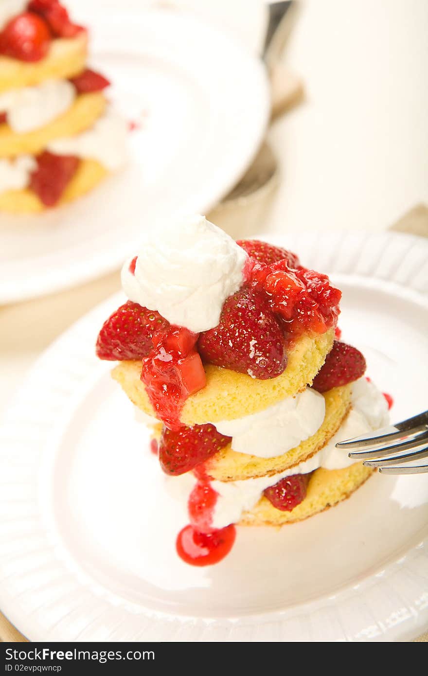 Three layer strawberry shortcake with fresh whipped cream. Three layer strawberry shortcake with fresh whipped cream