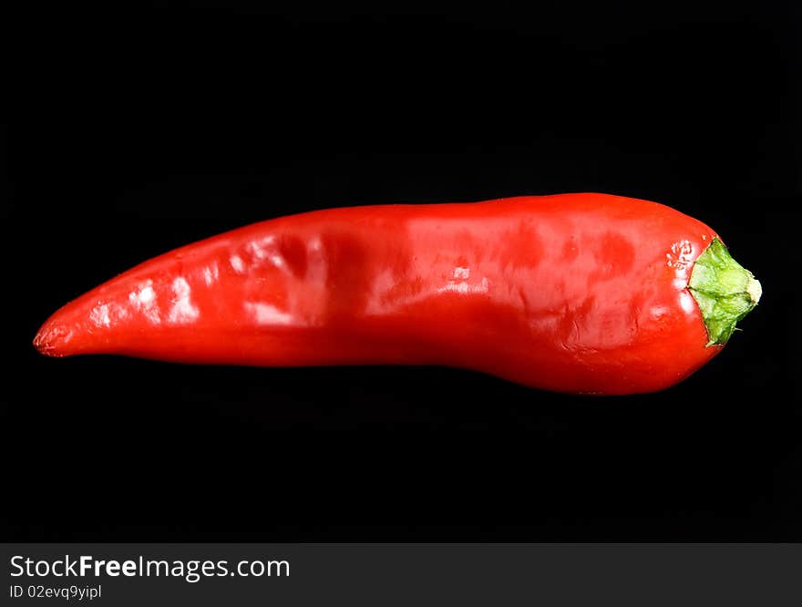 This krsny bitter pepper on black background