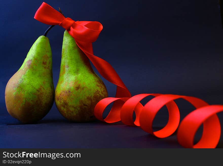 Two Pears One In A Red Gift Tape