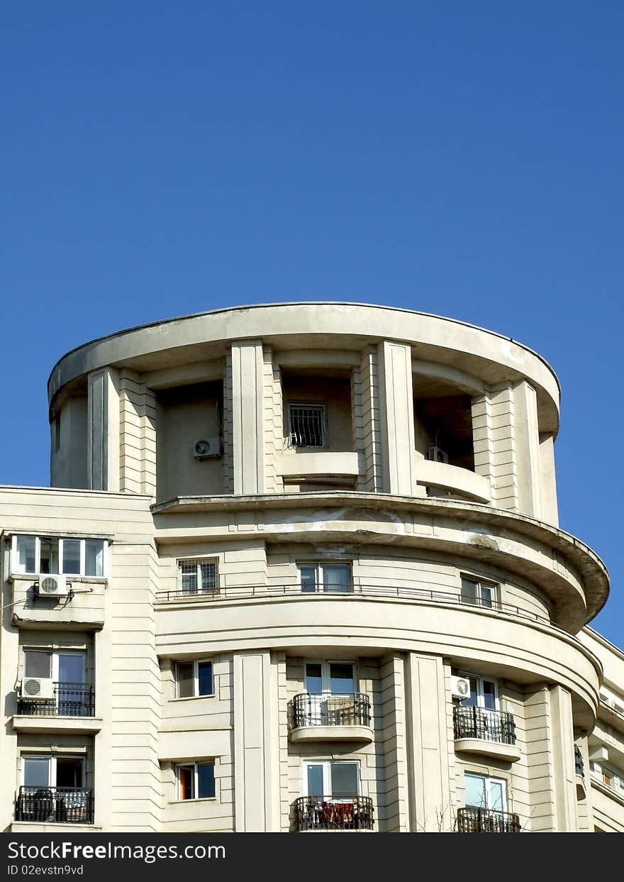 Penthouse on an old block against a blue sky