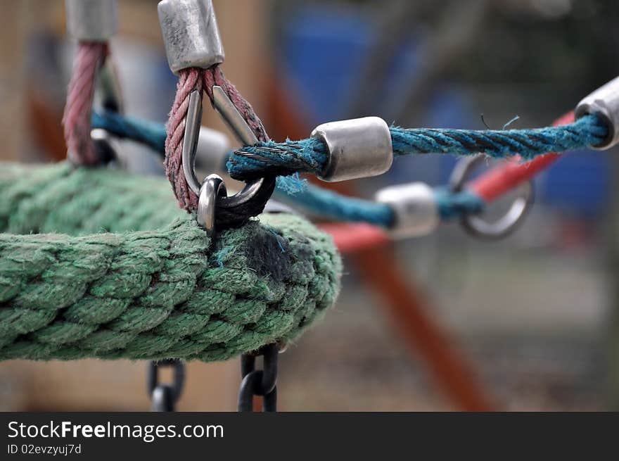 Colourful construction of ropes swing on playground. Colourful construction of ropes swing on playground