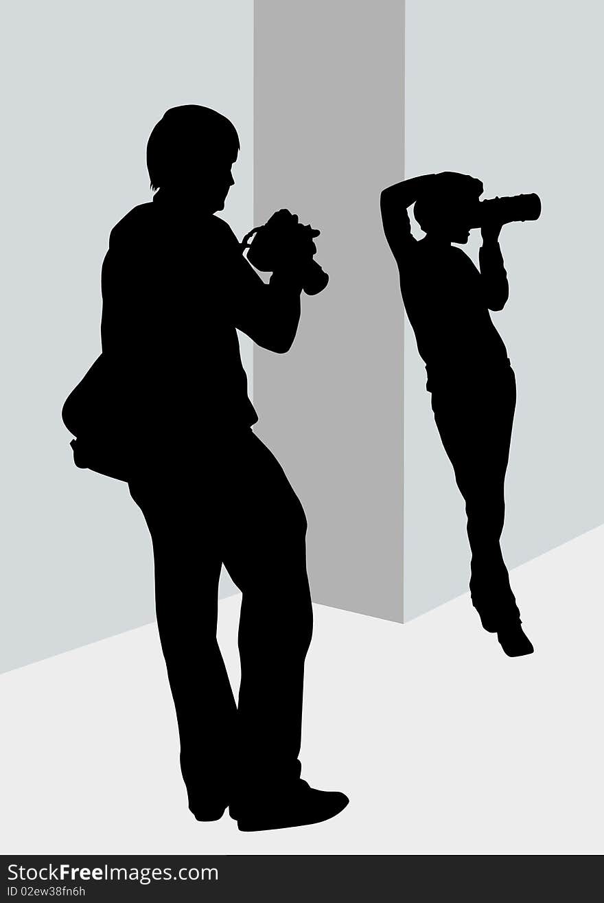 Image of young man and women photographers with equipment at work. Image of young man and women photographers with equipment at work