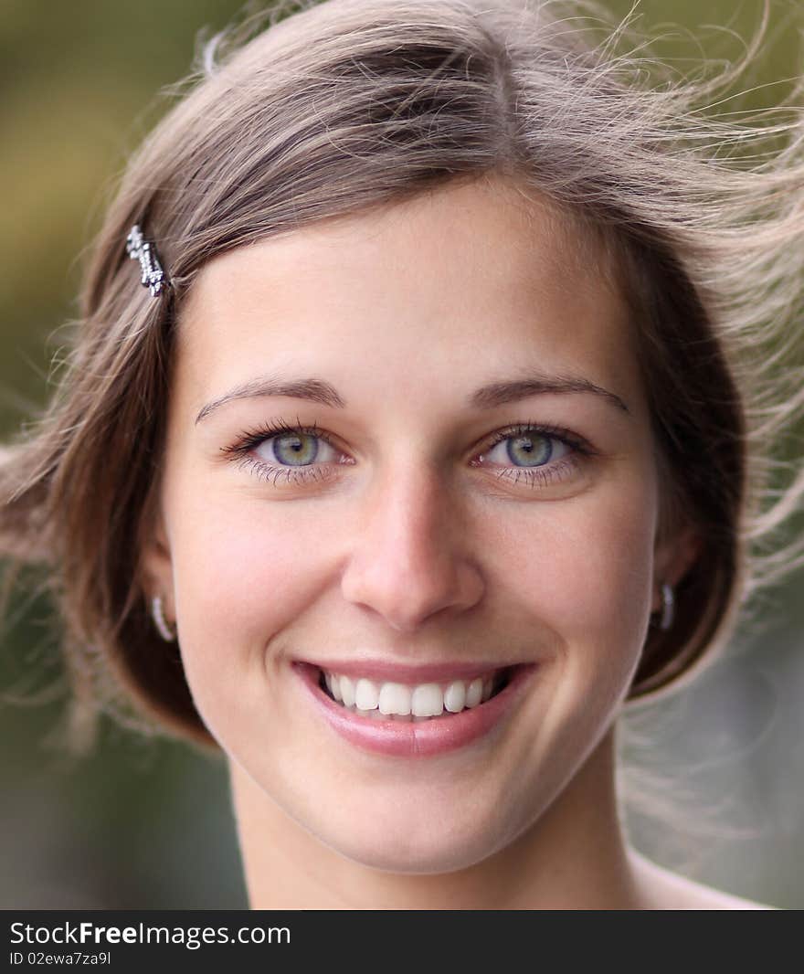 Closeup portrait of a happy young woman smiling