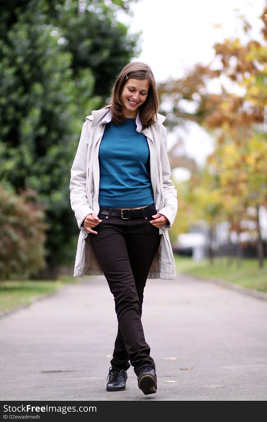 Beautiful young woman in autumn park