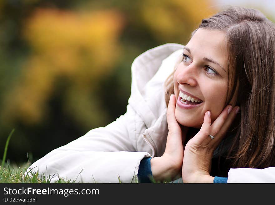 Woman Relaxing In The Grass