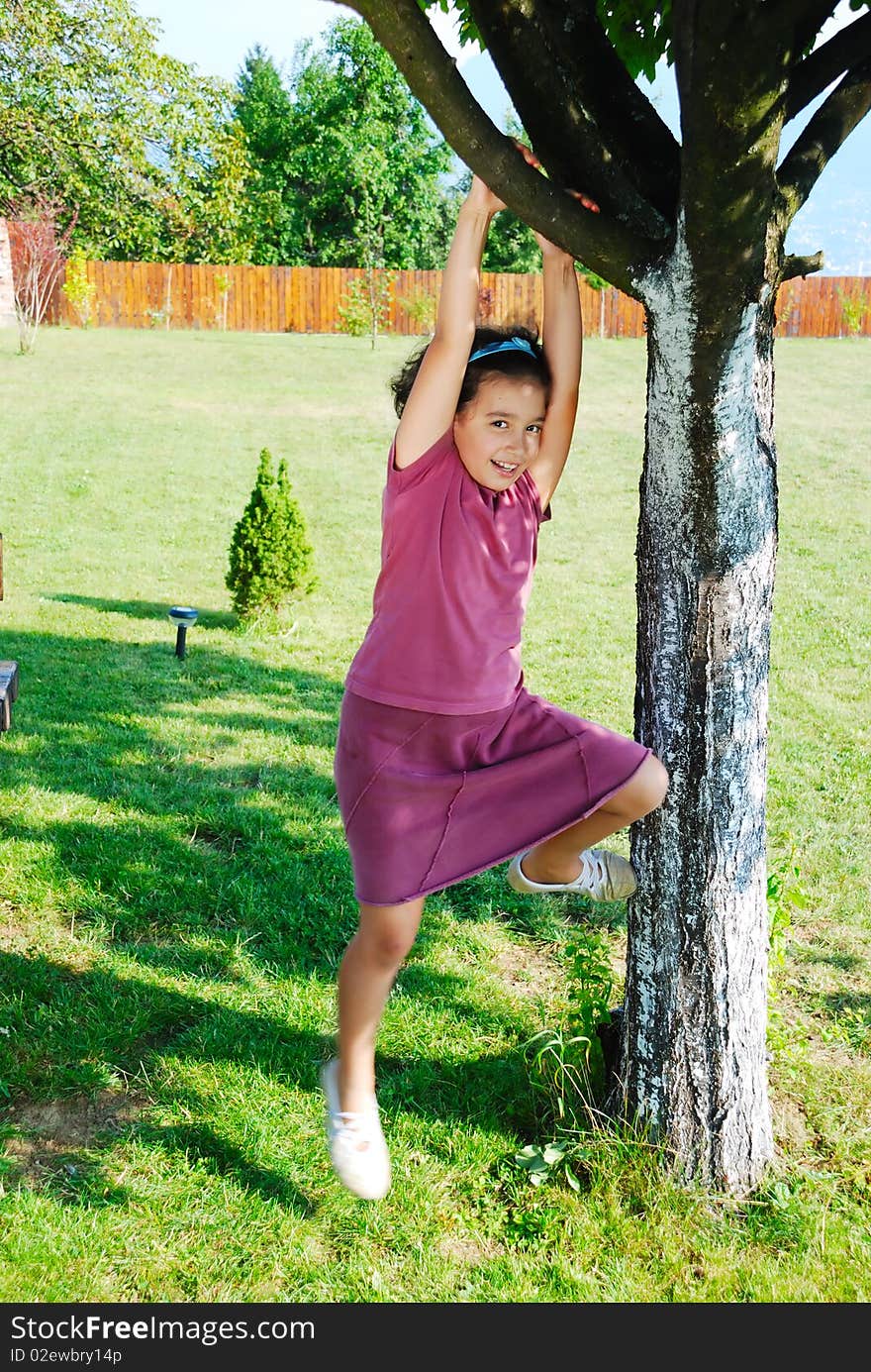 Girl climbing tree