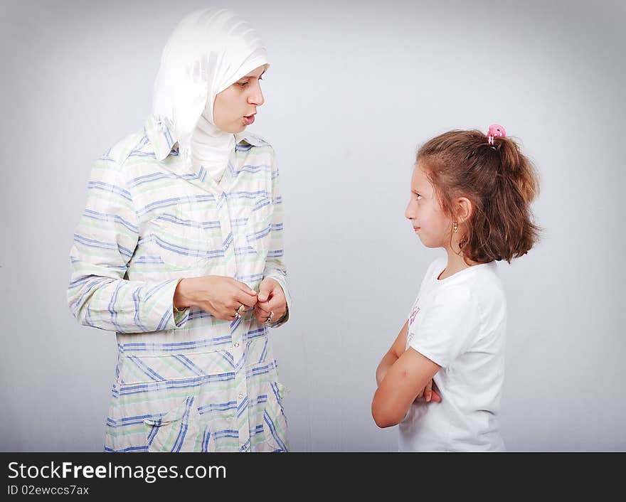 Muslim teacher with a little girl