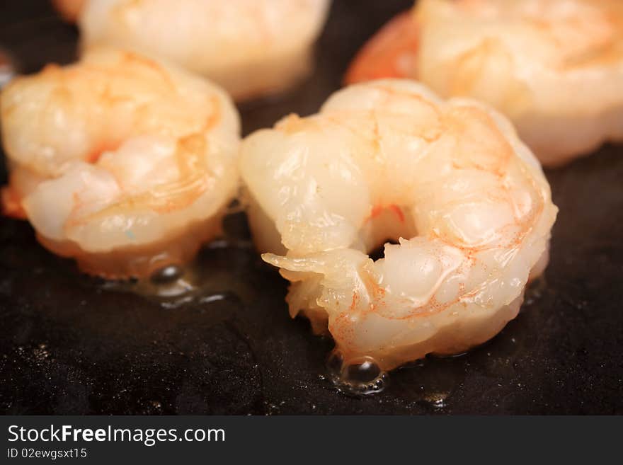 Photo of shrimp being sauteed. Photo of shrimp being sauteed.