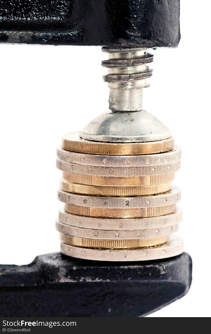 Pile of European coins squeezed in vice or vize isolated on white background