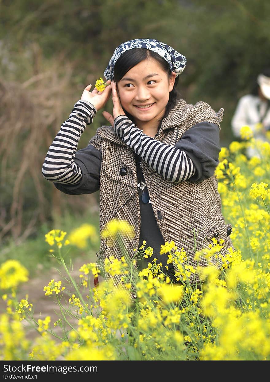 Beautiful young woman holding flower