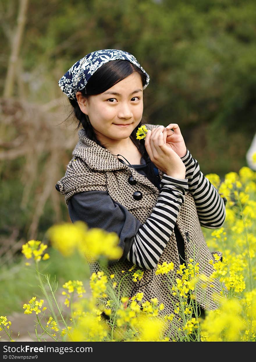 Beautiful young woman holding flower