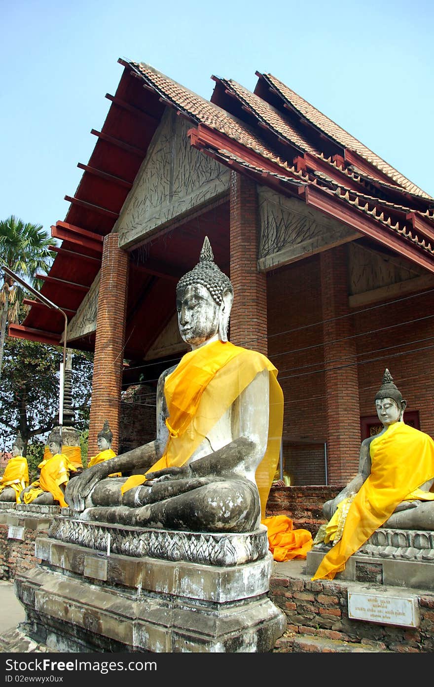 Buddhas sitting near thai Temple, Ayutthaya, Thailand. Buddhas sitting near thai Temple, Ayutthaya, Thailand