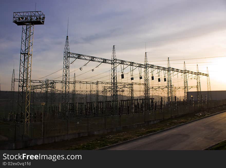 Electrical utility transformer substation on sunset. Electrical utility transformer substation on sunset