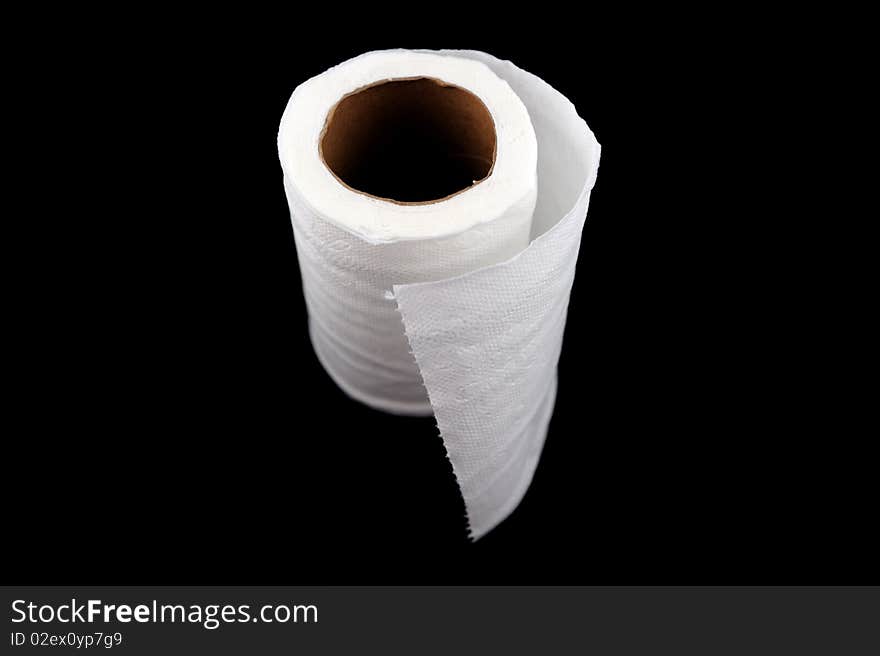 Roll of tissue paper on black