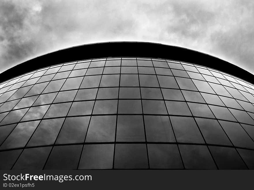 An abstract shot of a full glass panel building. An abstract shot of a full glass panel building