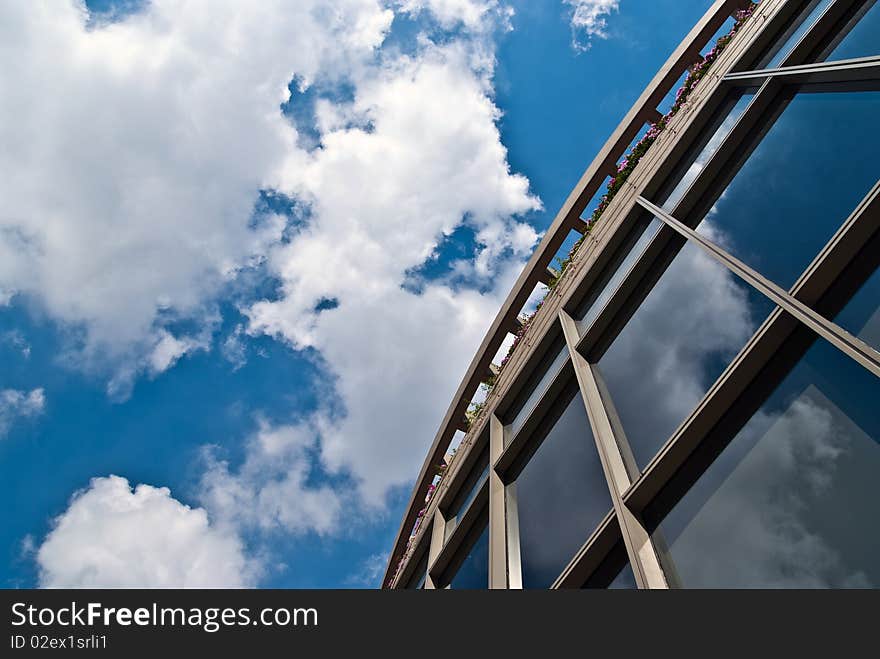 An abstract shot of a full glass panel building. An abstract shot of a full glass panel building