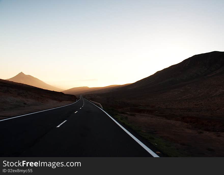 Endless road among desert mountains, Fuerteventura