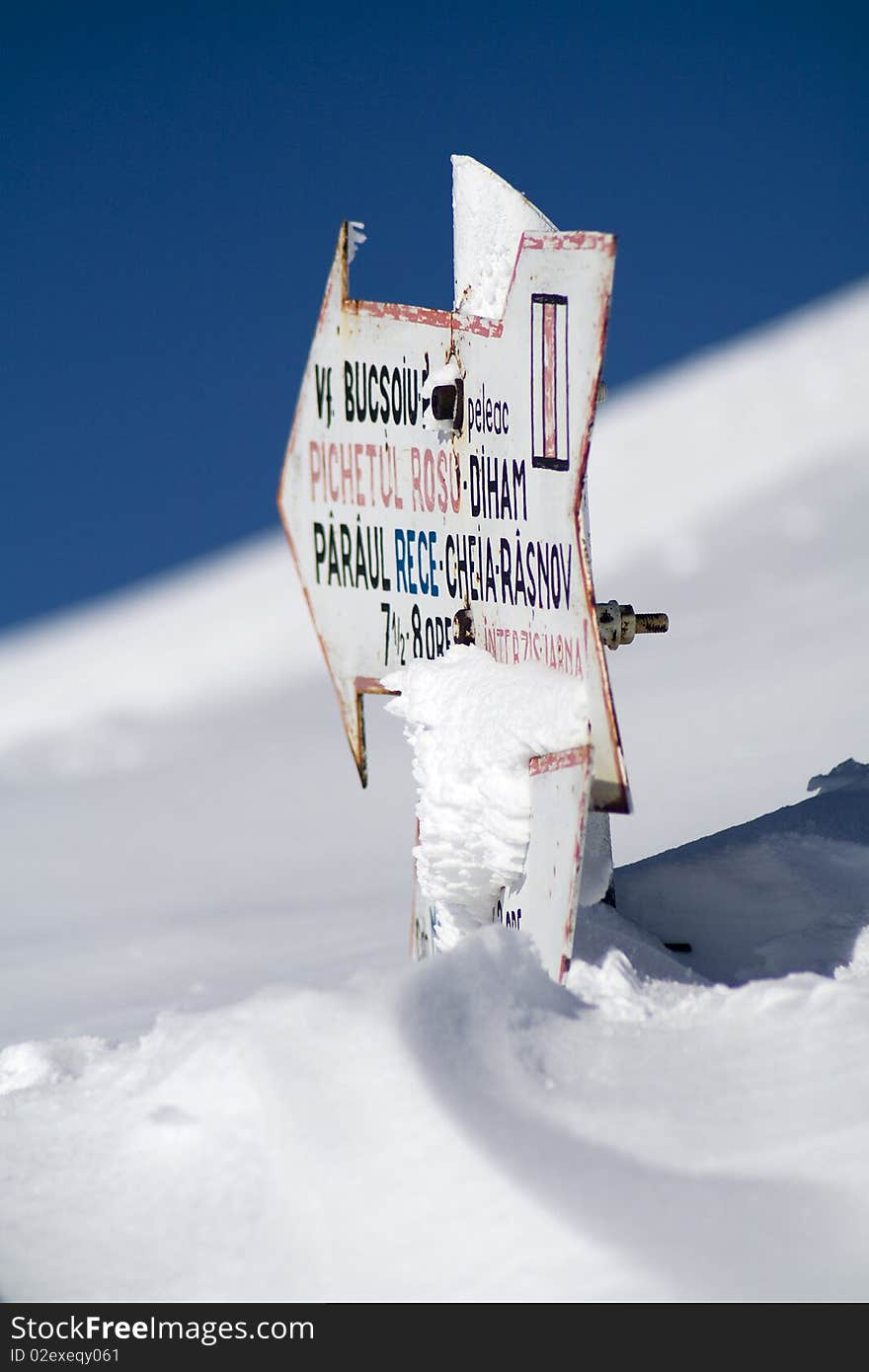 Touristic indicator buried in snow