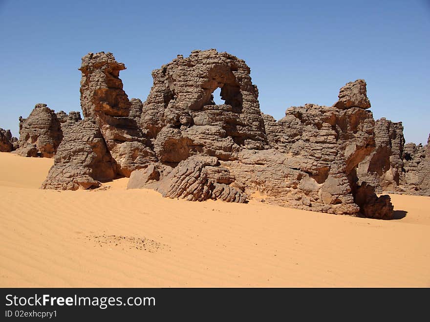 Sandstone peaks in the desert of Libya, in Africa. Sandstone peaks in the desert of Libya, in Africa