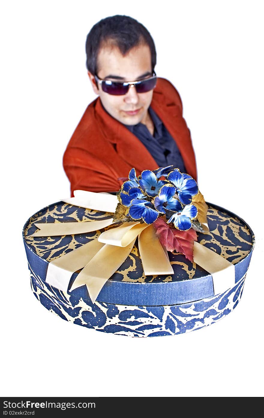 A young man is giving an ornamental giftbox. A young man is giving an ornamental giftbox